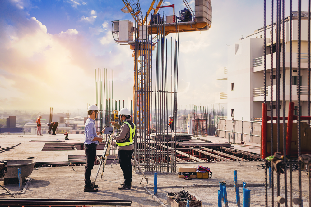 Surveyors on multi-storey building